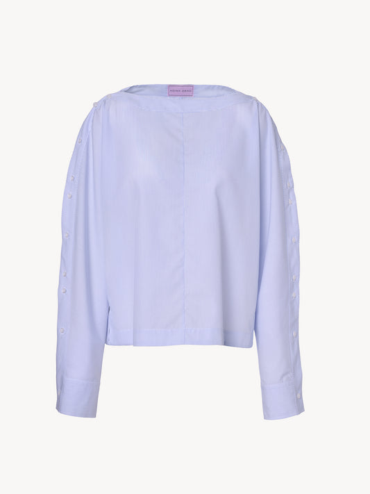 The Monday Shirt in blue, premium cotton shirt with geometric lines and asymmetric details, front view on white background
