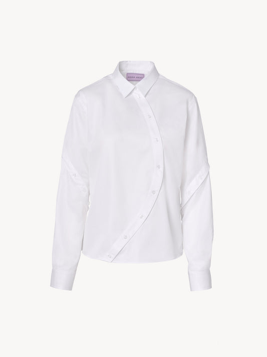 Oversized menswear-inspired white shirt with asymmetric details and structured design